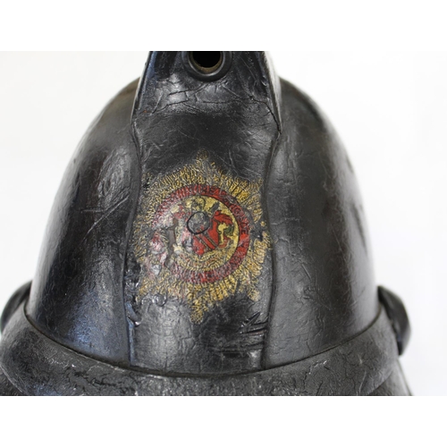 723 - 1920s era British Fire mans helmet. Made from thick leather with inner liner and chin strap. Makers ... 