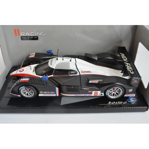 262 - Three boxed 1/18 scale highly detailed diecast car models to include Solido Racing Collection Peugeo... 