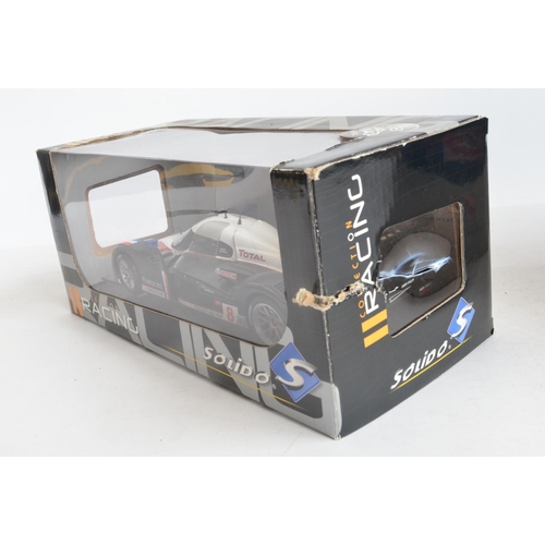 262 - Three boxed 1/18 scale highly detailed diecast car models to include Solido Racing Collection Peugeo... 