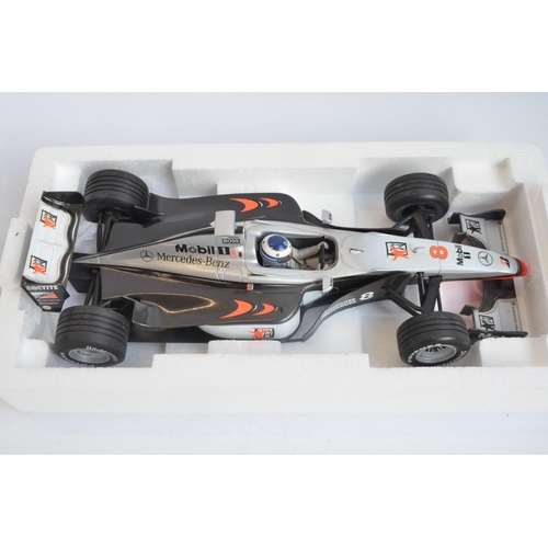 275 - Two boxed Minichamps (Paul's Model Art) 1/18 scale diecast McLaren Collection Mika Hakkinen F1 MP4 m... 