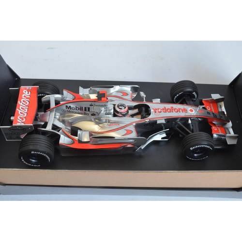 276 - Two boxed Minichamps (Paul's Model Art) 1/18 scale diecast McLaren Mercedes MP4 models to include Vo... 