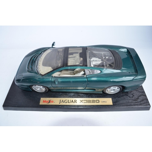 299A - 4x boxed diecast Jaguar model cars to include 3x 1/18 scale Maisto (2x XJ220 and 1x XK180) and a 1/2... 