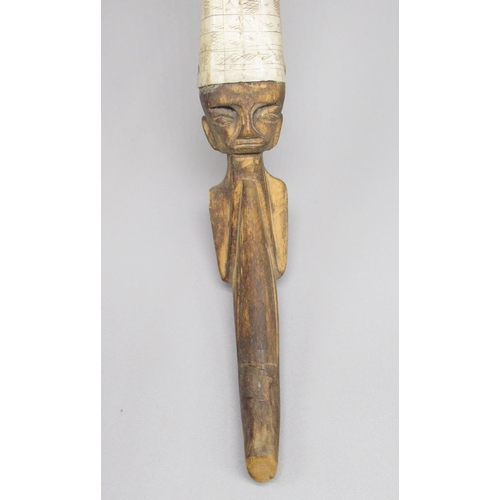 643 - Indonesian bone and hardwood blow dart holder, with ornate 'scrimshaw' work to bone body and figural... 