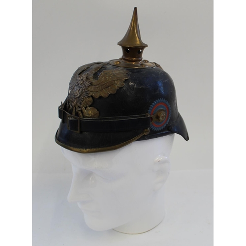 711 - Prussian Pickelhaube. A nice example with the eagle plate and spike in very good condition and rear ... 