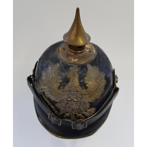 711 - Prussian Pickelhaube. A nice example with the eagle plate and spike in very good condition and rear ... 