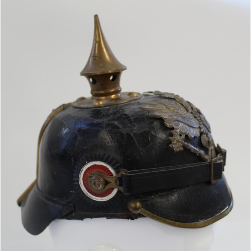 711 - Prussian Pickelhaube. A nice example with the eagle plate and spike in very good condition and rear ... 