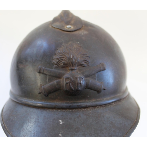 715 - French WWI Adrian model Artillery Helmet. Showing remnants of blue paint. Lacking liner but with one... 