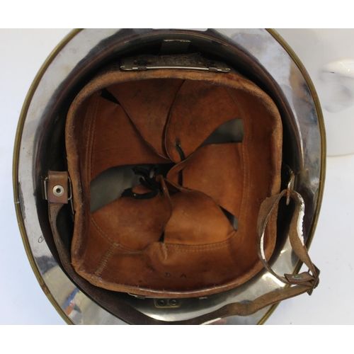 722 - French Fireman's Helmet model 1933. Steel Helmet with brass plate  and brass rim. Complete with leat... 