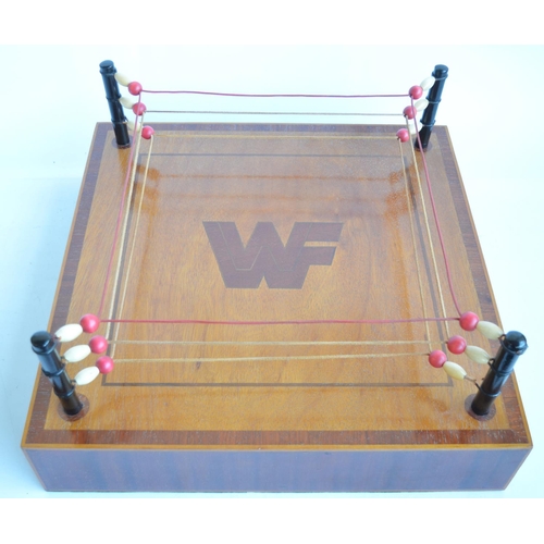 438 - An interesting and well constructed homemade satinwood and mahogany miniature Wrestling Federation w... 