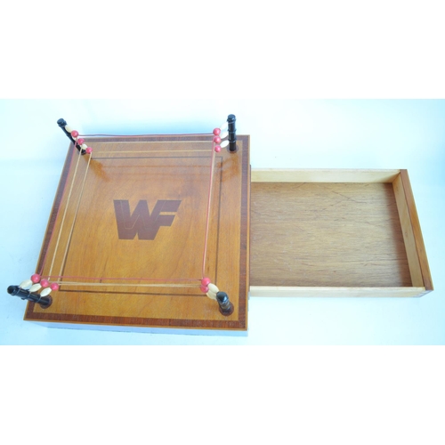 438 - An interesting and well constructed homemade satinwood and mahogany miniature Wrestling Federation w... 