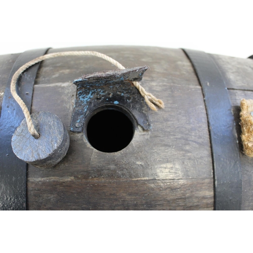 767 - Royal Naval cooped oak Grog barrel with iron hoops, wood bung and rope handles. 61cm wide