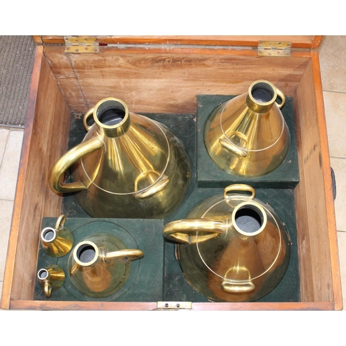 769 - Cased collection 6 graduated conical brass measures in large mahogany chest with brass plaque engrav... 