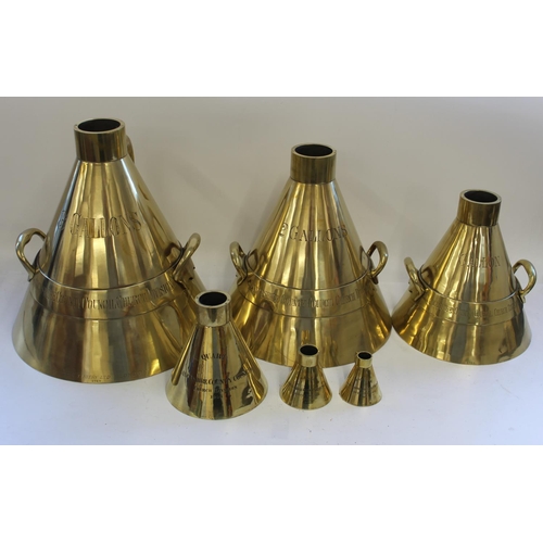 769 - Cased collection 6 graduated conical brass measures in large mahogany chest with brass plaque engrav... 