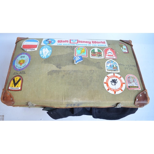 768 - Suitcase containing naval uniforms and clothing, a pair of Heath & Co binoculars (leather case stamp... 