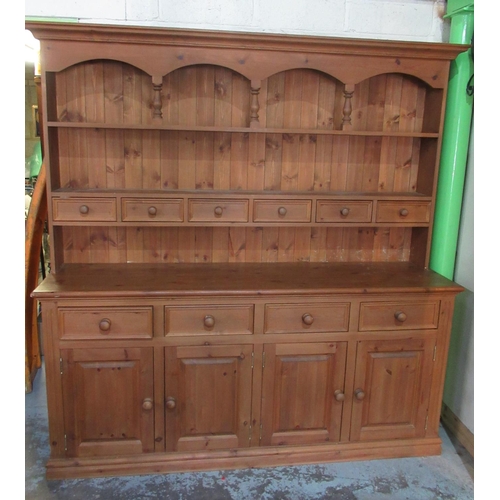 311 - Large pine dresser, raised back with spice drawers, base with four drawers and four cupboards, W197c... 