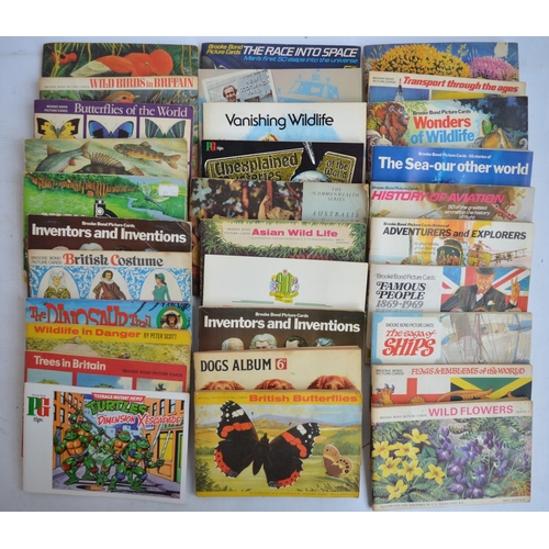 935 - Collection of table top games, Brooke Bond (and others) card albums, a Robert Harrop Desperate Dan f... 