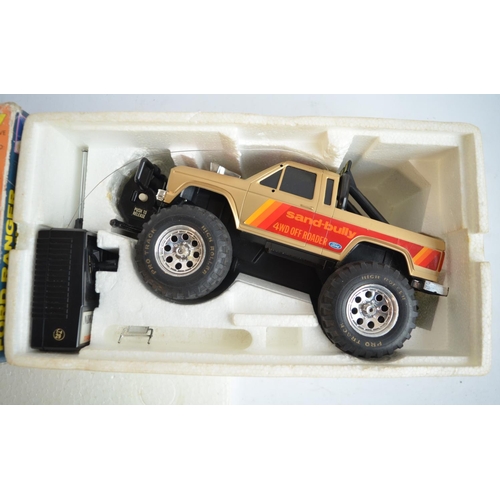 640 - Four radio controlled car models to include a vintage 1/18 scale Nikko Ford Ranger 4x4 Power Winch.