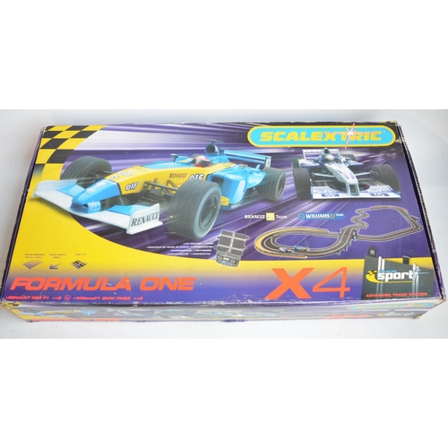 641 - Scalextric C1139 Formula One X4 Renault R23 and Williams BMW FW23 2 car racing set, contents in near... 