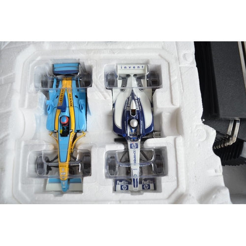 641 - Scalextric C1139 Formula One X4 Renault R23 and Williams BMW FW23 2 car racing set, contents in near... 