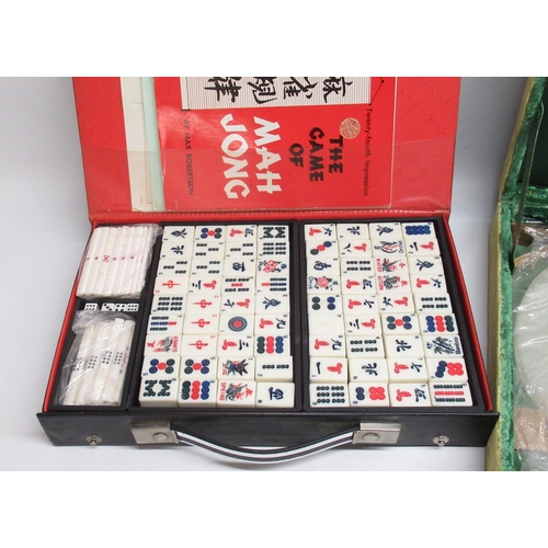 60 - Cased green and milky-white chess set with circular board, and a cased Mahjong set (2)