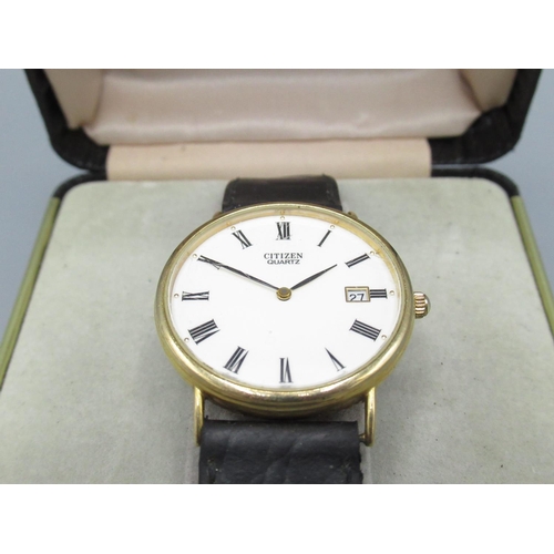 601 - Citizen gold quartz wristwatch with date, signed white Roman dial, three piece case with snap on bez... 