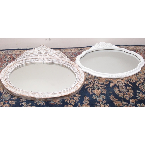 314 - Two distressed white paint finish oval wall mirrors, W71cm H78cm max (2)