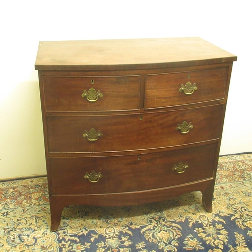 317 - Small Geo.1V bow front mahogany chest of two short and two long drawers, with shaped apron and brack... 