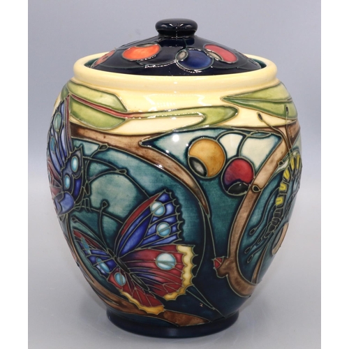 Moorcroft Pottery: Harting pattern jar and cover, decorated with flowers, butterflies, berries, and ladybirds, dated 2002, H15cm