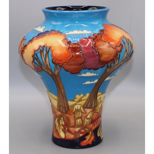 Moorcroft Pottery: vase decorated with stylised trees against a blue sky, dated 2002, initialed PG, H20.5cm