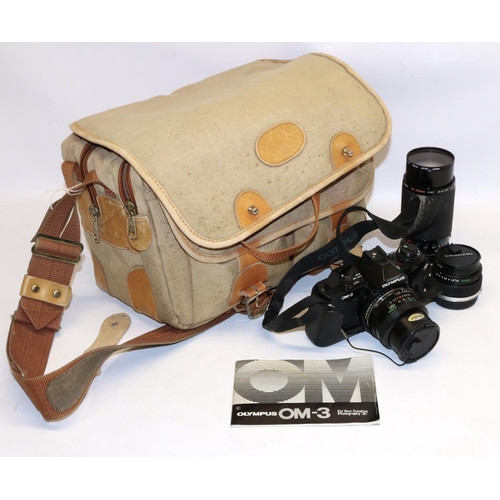 908 - Olympus OM-3 SLR camera body, three HOYA lenses, camera bag