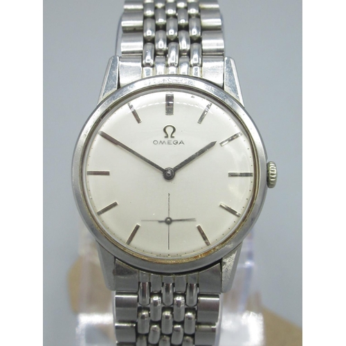 612 - 1960's Omega stainless steel hand wound wristwatch, signed silvered dial with applied baton hours wi... 