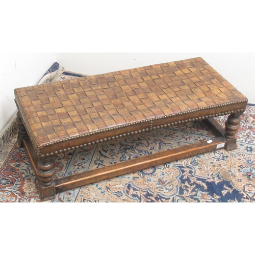 731 - C20th rectangular footstool, with nailed plaited leather top on bobbin turned supports with stretche... 