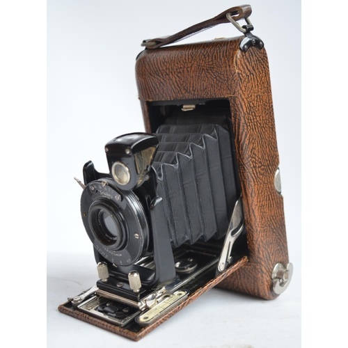 700 - Pair of vintage Jules Huet binoculars with cowhide case, a camera by Ensign, a glass, steel and half... 