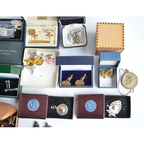 701 - Collection of cuff-links, pin badges, a sterling silver St Christopher necklace by Christopher James... 