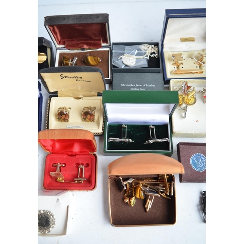 701 - Collection of cuff-links, pin badges, a sterling silver St Christopher necklace by Christopher James... 