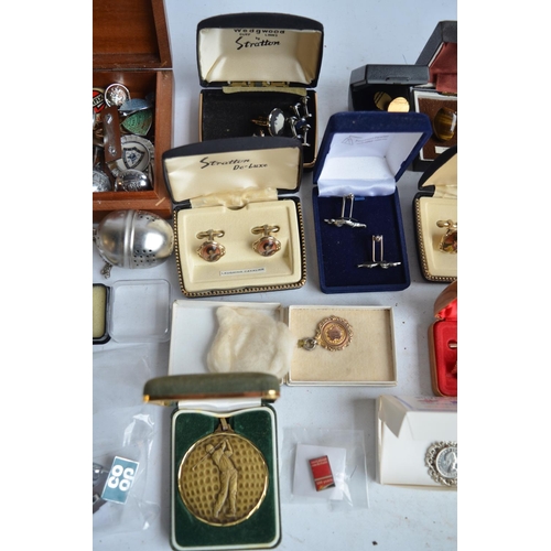 701 - Collection of cuff-links, pin badges, a sterling silver St Christopher necklace by Christopher James... 