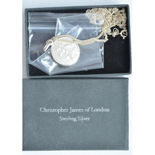 701 - Collection of cuff-links, pin badges, a sterling silver St Christopher necklace by Christopher James... 