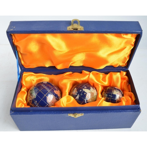 713 - Osborne & Allen gemstone 3 globe paperweight set and a 150mm gemstone globe by the same manufacturer... 