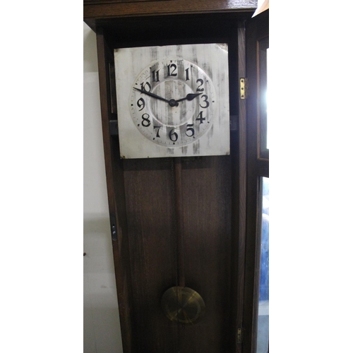 629 - C20th continental oak long case clock, glazed door and square silvered Arabic dial with twin weight ... 