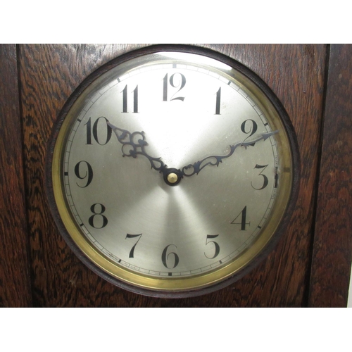 179 - C20th oak long cased clock, with glazed door, circular silvered Arabic dial with three train movemen... 