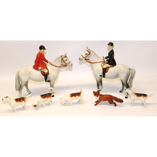 188 - Beswick hunting group, comprising Huntsman No. 1501 and Huntswoman No. 1730 on dapple greys, four ho... 