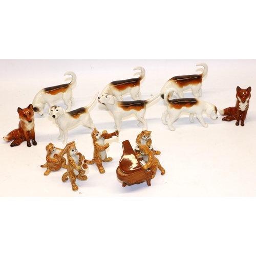 192 - Two Beswick seated foxes No. 1748; six Beswick foxhounds; and five unmarked cat figures with musical... 