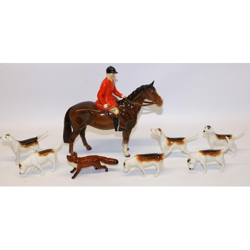 194 - Beswick Huntsman on bay/brown horse No. 1501, fox No. 1440 with black tipped tail, and six foxhounds... 