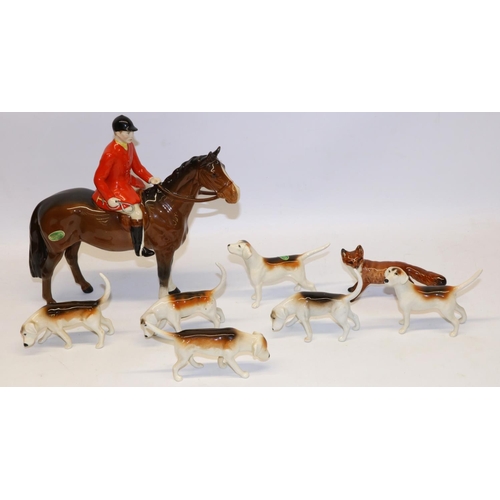 195 - Beswick Huntsman on bay/brown horse No. 1501, fox No. 1440 with black tipped tail, and six foxhounds... 