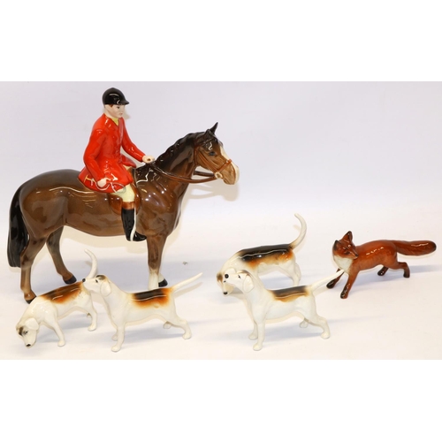 196 - Beswick Huntsman on bay/brown horse No. 1501, fox No. 1440 with black tipped tail, and four foxhound... 