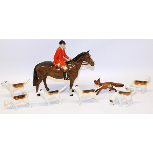 197 - Beswick Huntsman on bay/brown horse No. 1501, fox No. 1440 with black tipped tail, and six foxhounds... 