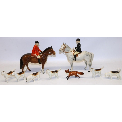 199 - Beswick hunting group, comprising Huntsman No. 1501 on bay/brown, Huntswoman No. 1730 on dapple grey... 