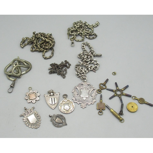 619 - Victorian silver single tapering curb link watch Albert with fob, five other silver fobs gross weigh... 