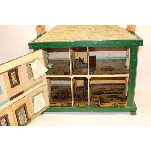 153 - Mid C20th dolls house with tin plate windows and door, L64cm, and a collection of 1950s and later do... 