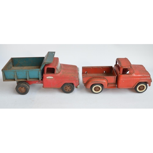 111 - Two vintage pressed steel pick up truck models to include a Tonka Toys dump truck (in working order)... 